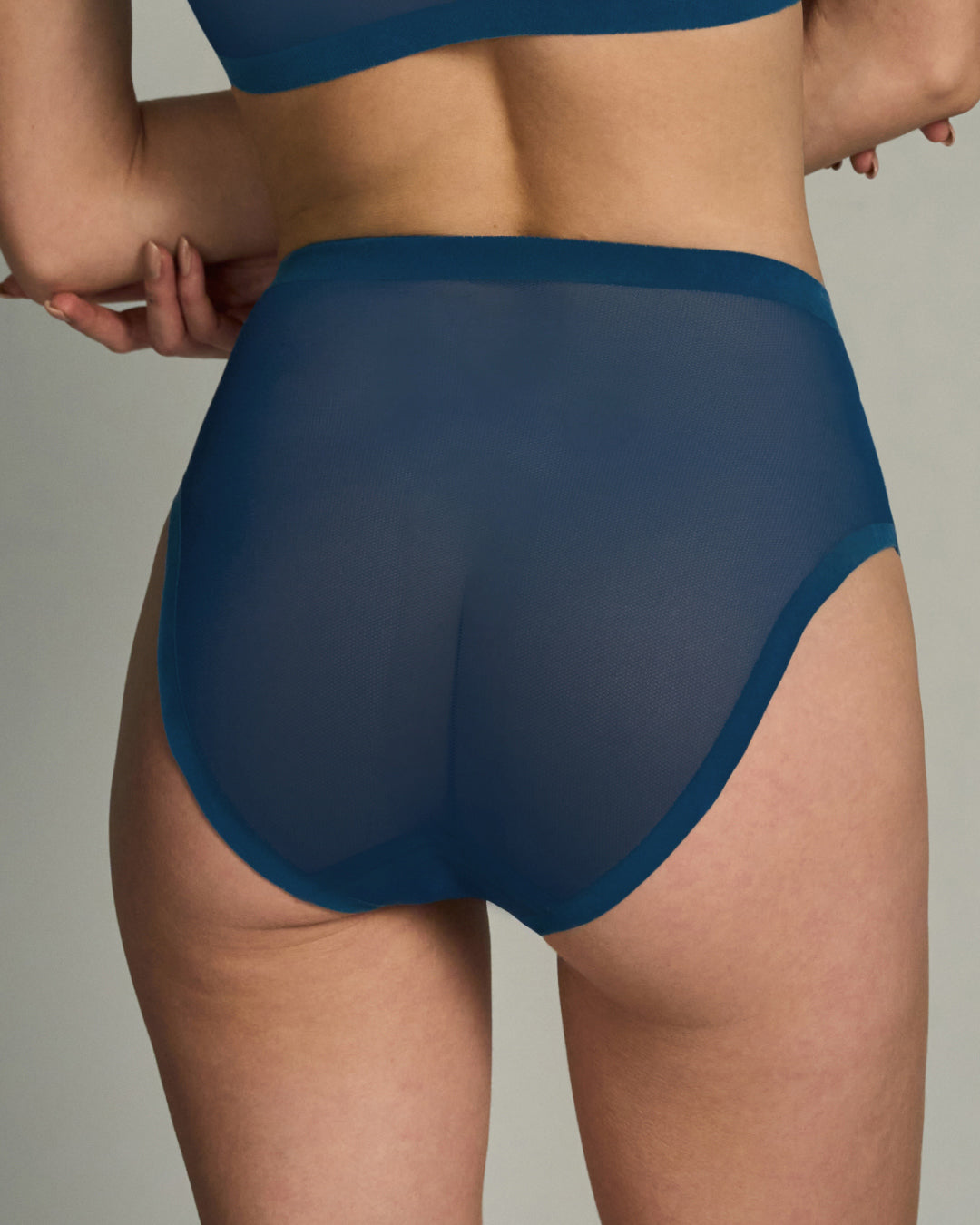 Opal blue brief sheer on a neutral background