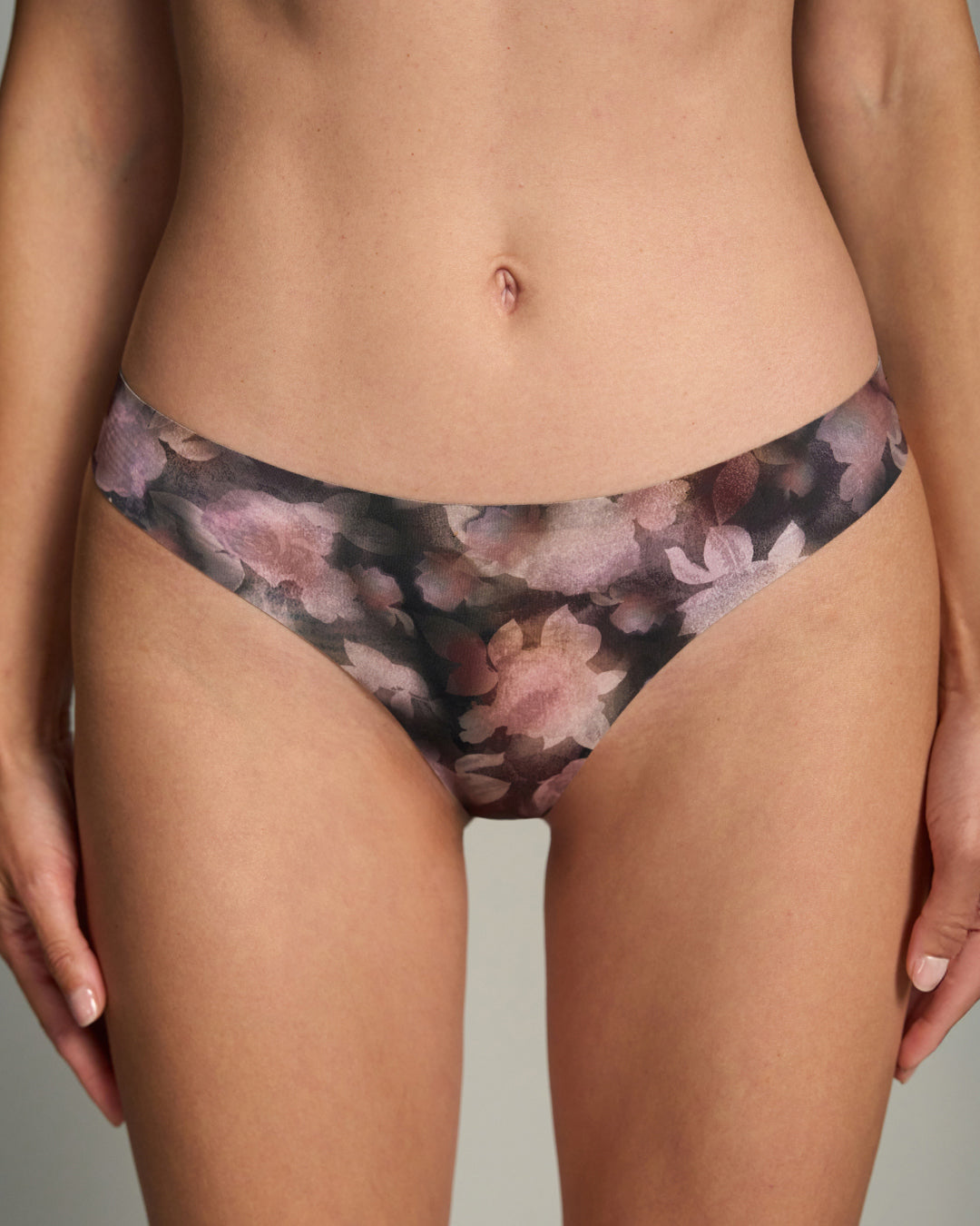 Duskwild-patterned thong worn by a person on a neutral background
