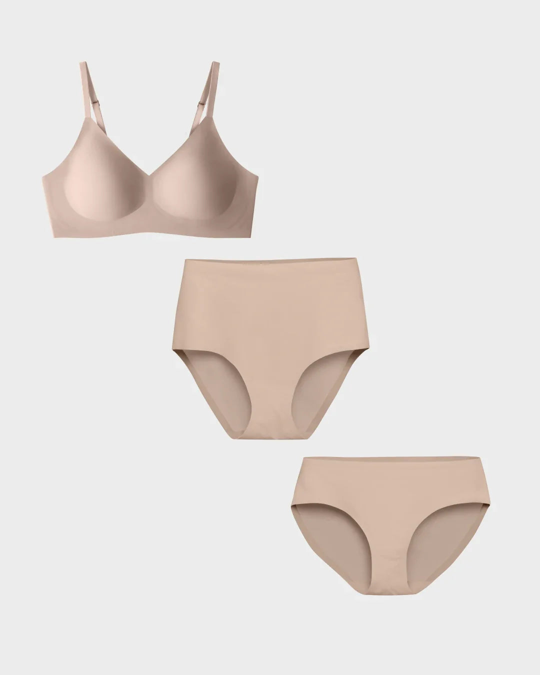 Seamless bralette top in nude with matching high-waisted and bikini panties displayed on a light gray background